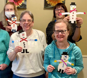 Women with Snowman craft projects