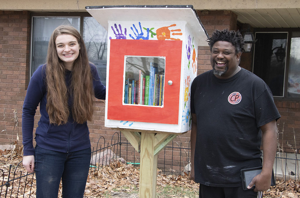 Scout and resident with little library