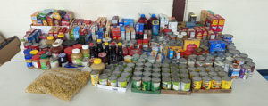 A table covered with non perishable food items.
