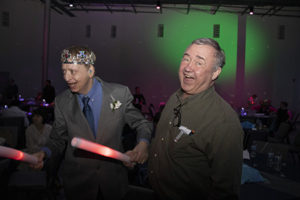 A resident and staff member out on the dance floor.