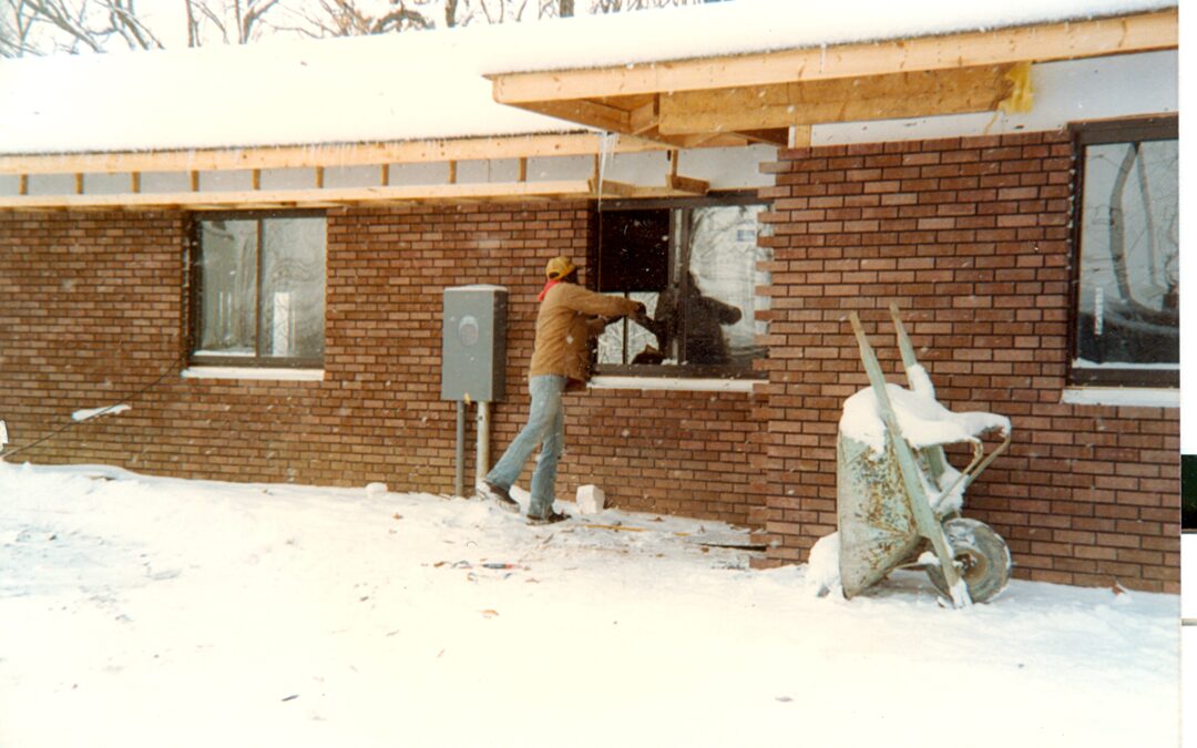 a brick structure being built in the winter