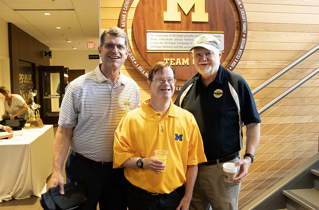 Jim Harbaugh, Joe and Norm Neuman at the University of Michigan Golf Course
