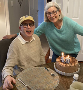 Man with his mom celebrating a birthday.