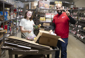 A young man and woman in a storage pantry