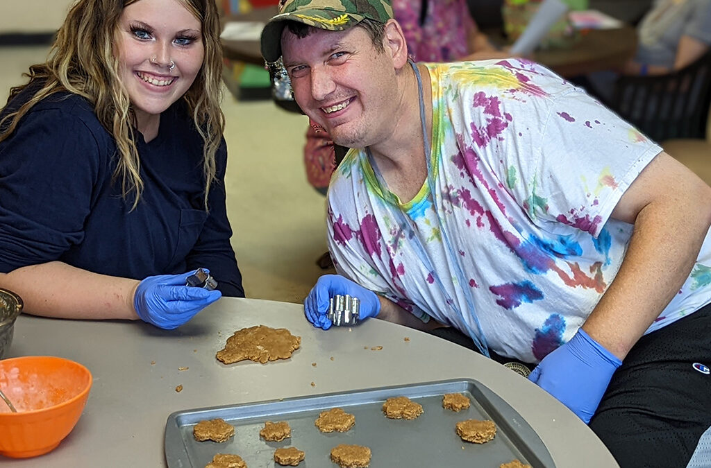 SLC staff working with a resident