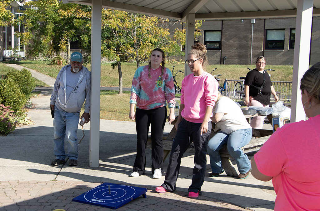 St. Louis Center staff having fun on the playground